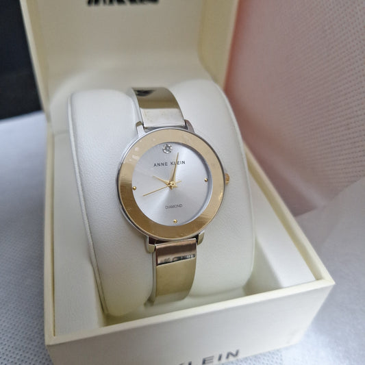 Anne Klein Women's Genuine Diamond Dial Bangle Watch,