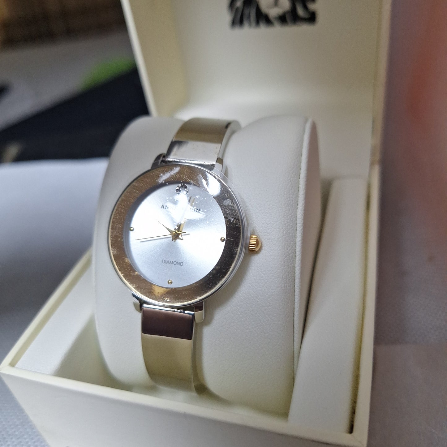 Anne Klein Women's Genuine Diamond Dial Bangle Watch,