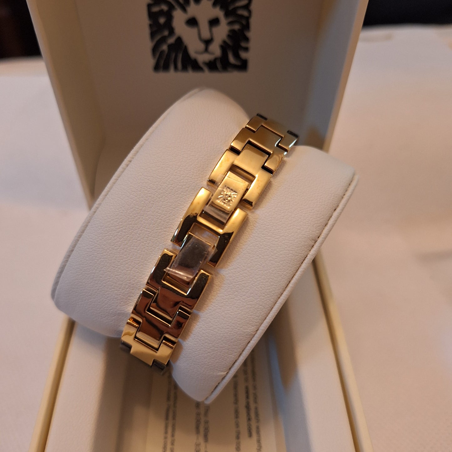 Anne Klein Women's Premium Crystal Accented Resin Bangle Watch,