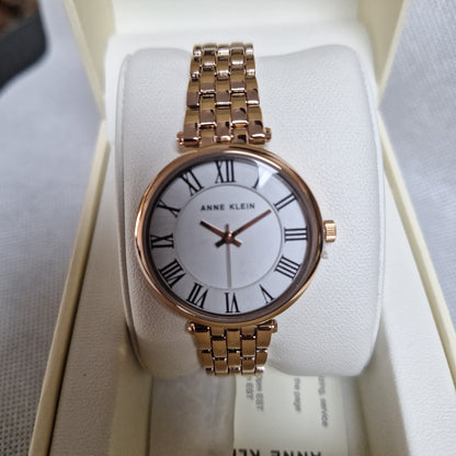 Anne Klein Women's Roman Numeral Metal Watch,