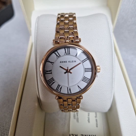 Anne Klein Women's Roman Numeral Metal Watch,