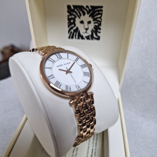 Anne Klein Women's AK/3322 Roman Numeral Metal Bracelet Watch l White/Gold