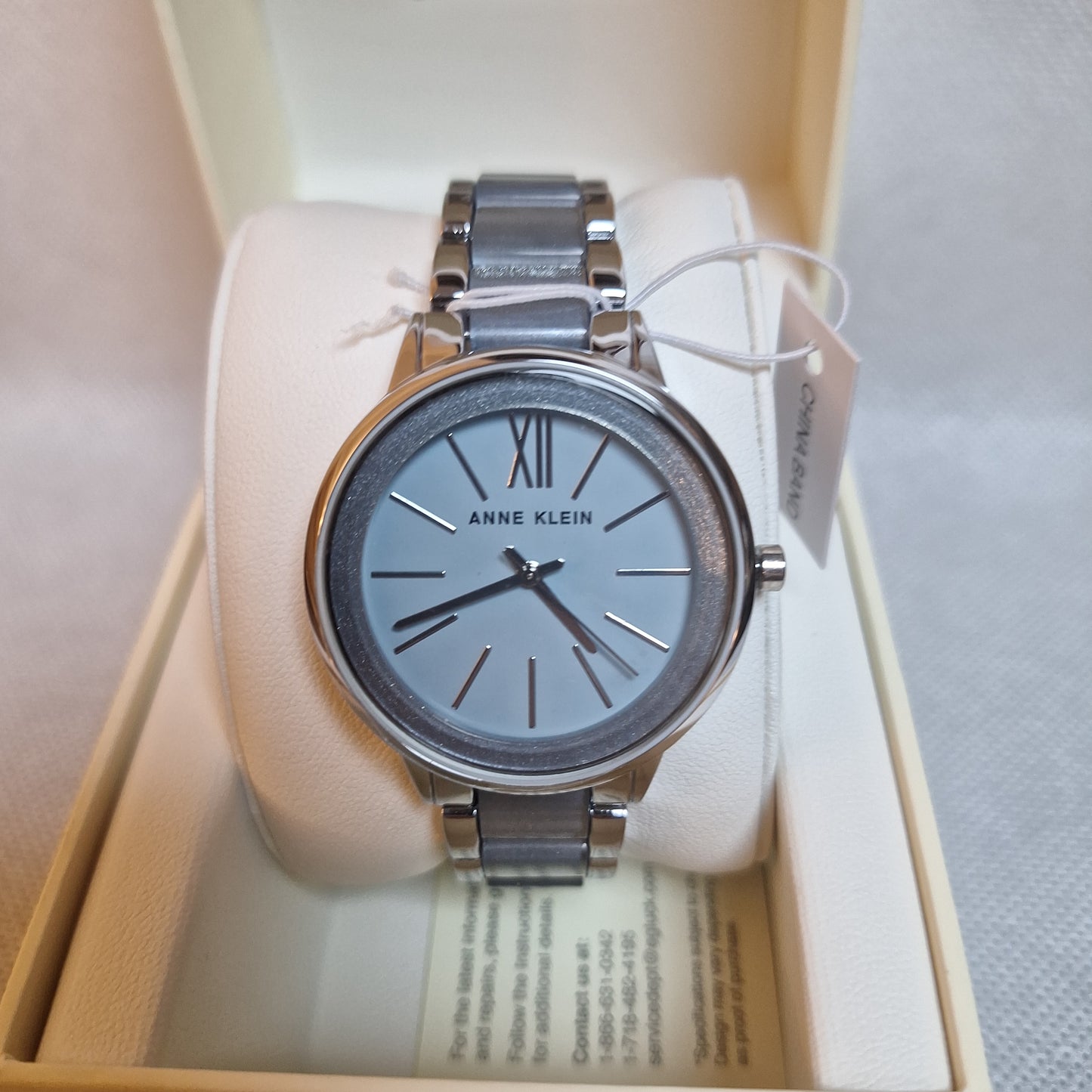 Anne Klein Women's Watch, Silver-tone adjustable link bracelet with light blue shimmer
