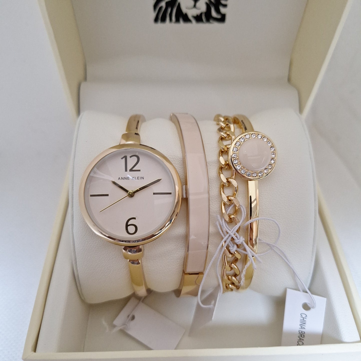 Anne Klein Women's Bangle Watch and Premium Crystal Accented Bracelet Set