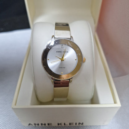 Anne Klein Women's Genuine Diamond Dial Bangle Watch,