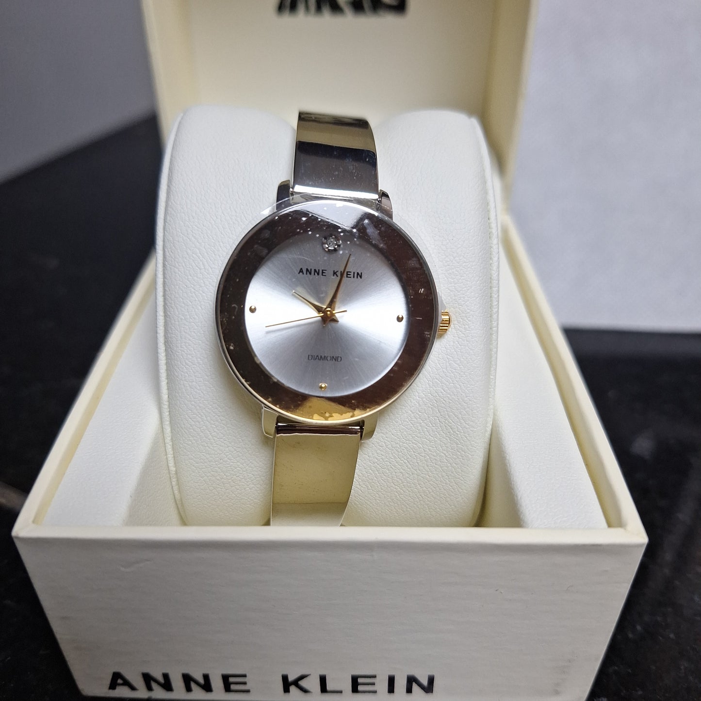 Anne Klein Women's Genuine Diamond Dial Bangle Watch,