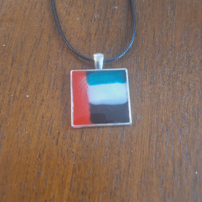 Necklace with a square pendant featuring inspired by UAE flag