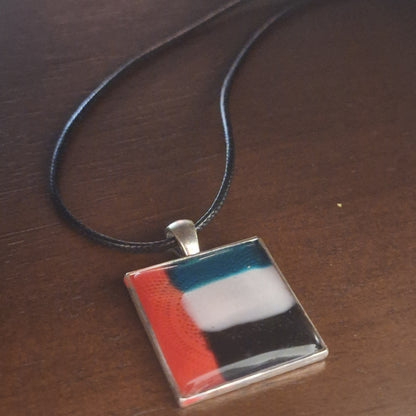 Necklace with a square pendant featuring inspired by UAE flag